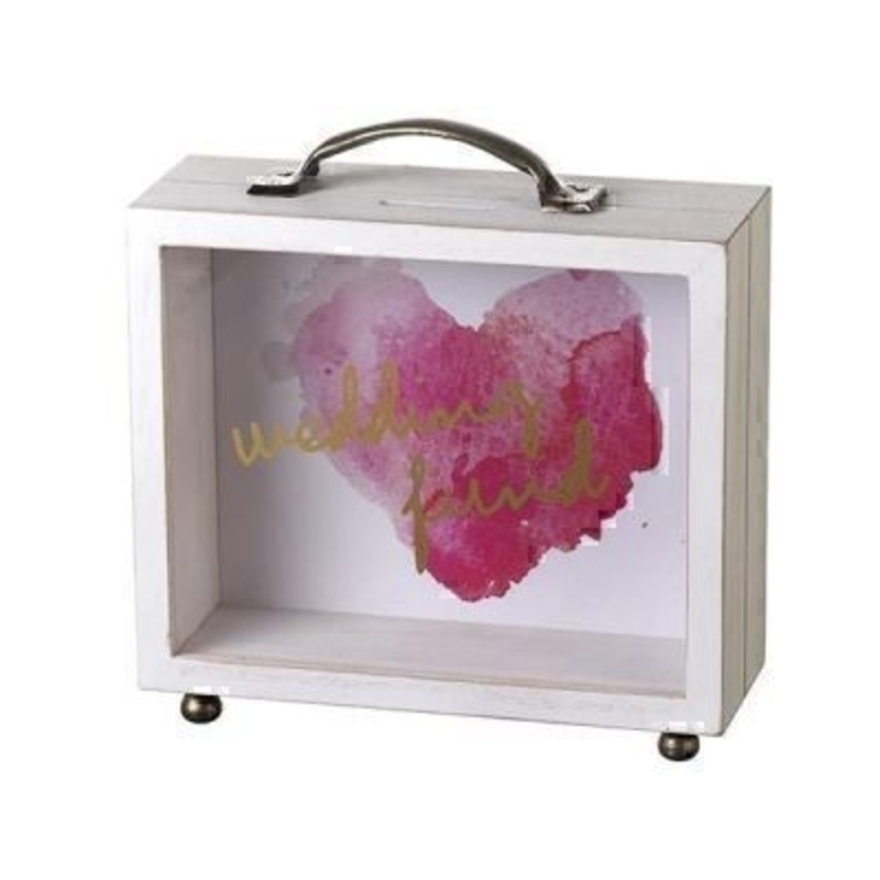 This Wedding Fund See Through Money Box by Heaven Sends is perfect for anyone saving for their wedding. In the shape of a suitcase with a handle on the top it features a pink heart on the background and the front is see through with the words Wedding Fund